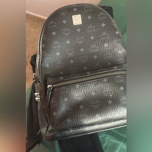 MCM rhinestone black backpack it is used but no scuffs, scratches on the leather